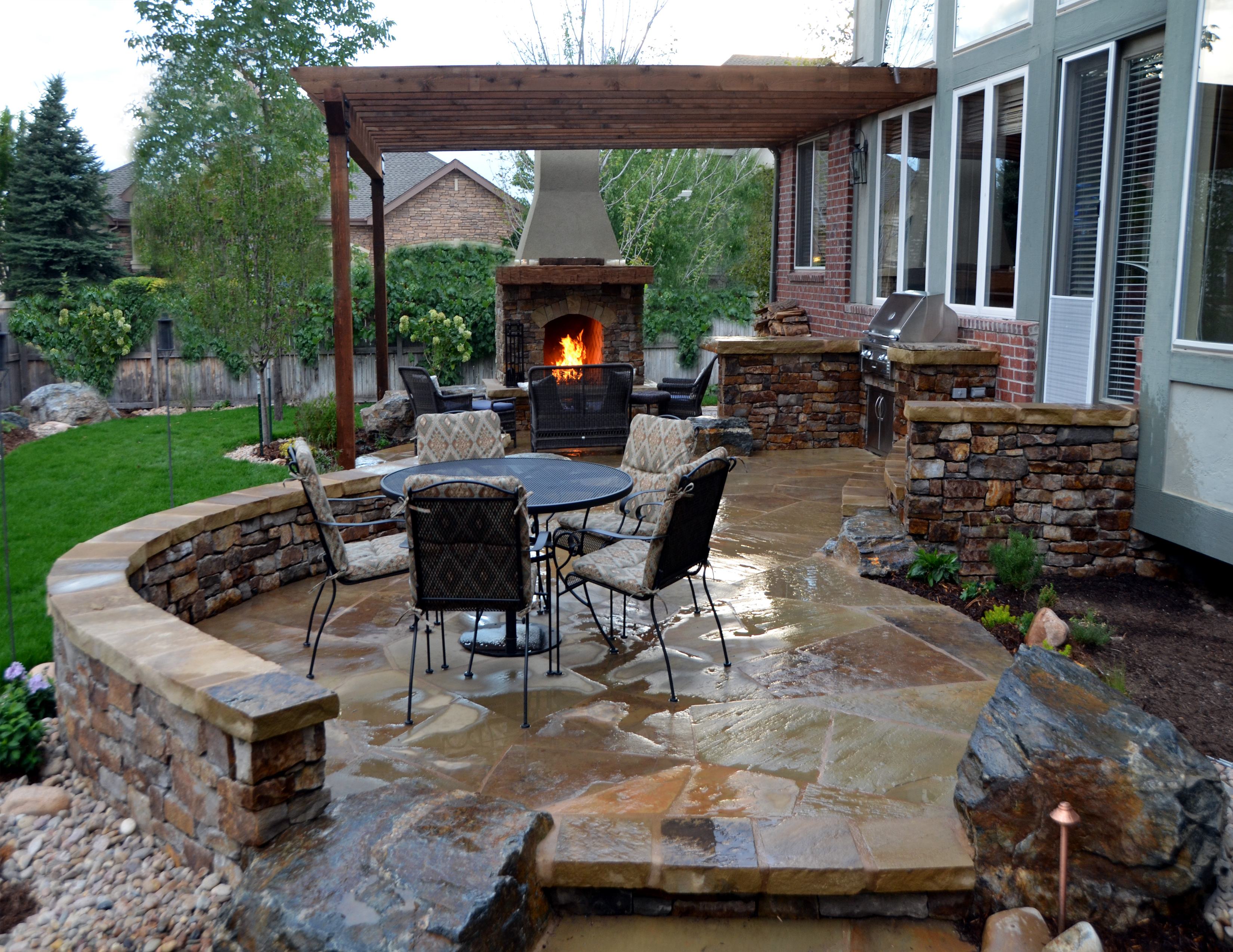 Flagstone Patio with Stone Fireplace and Outdoor Kitchen
